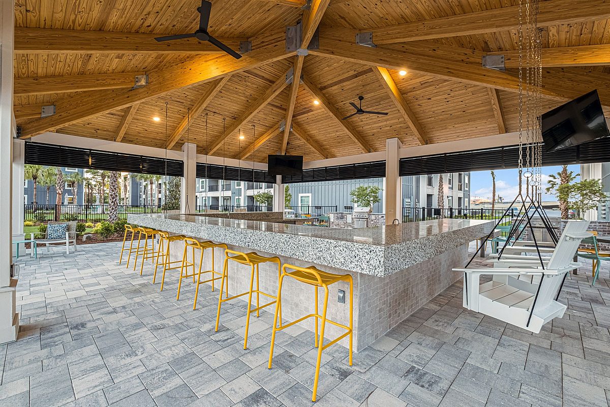 grilling station with high chairs and counter table