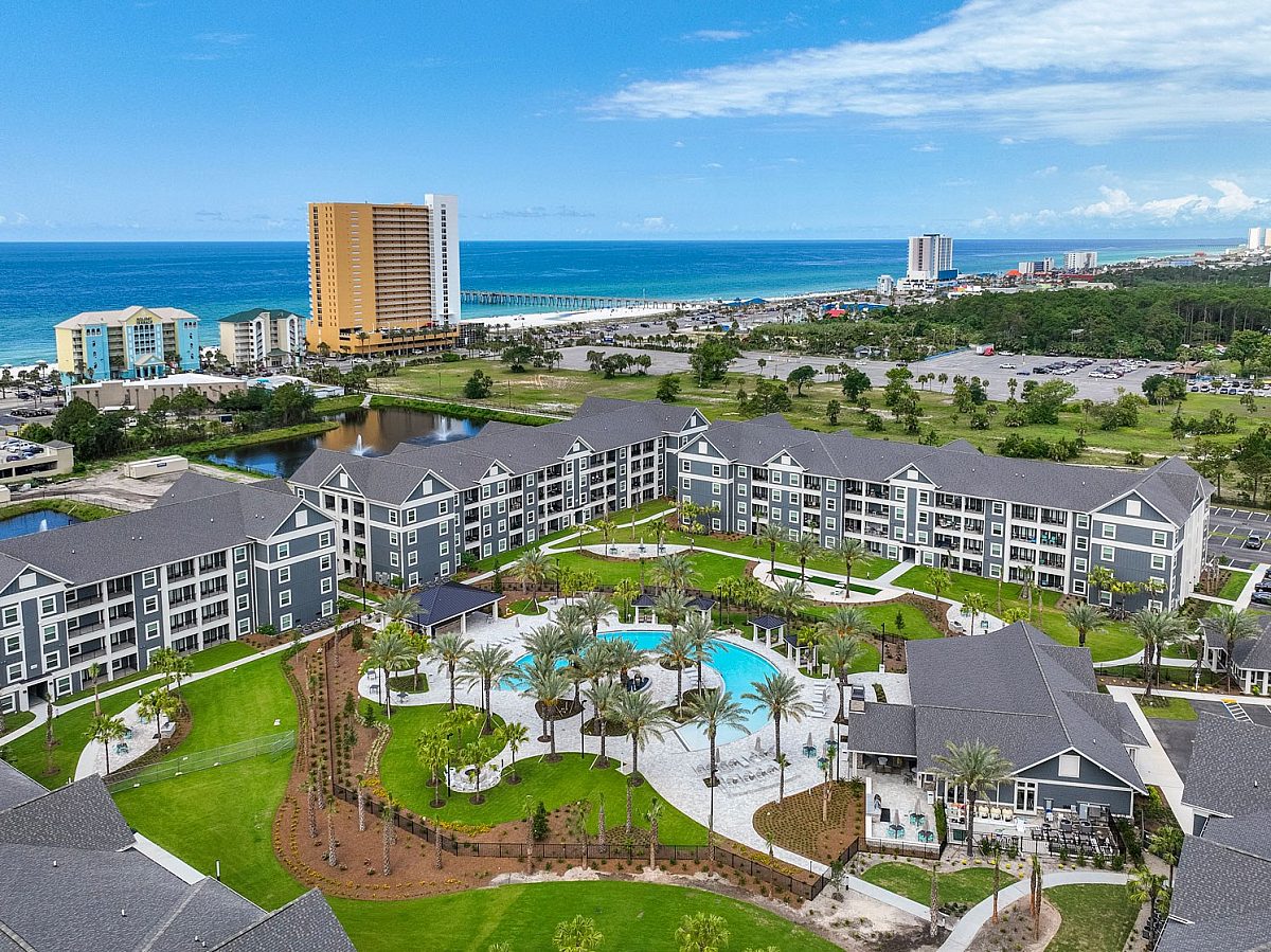 apartment complex top view with swimming pool and palm tress